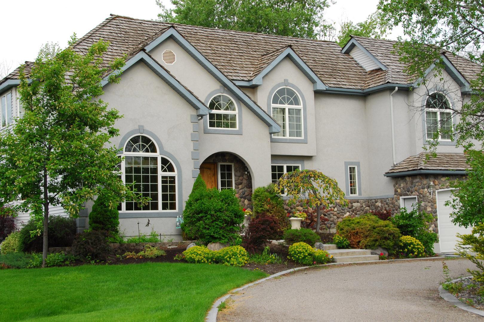 Exterior view of a house with a car entrance